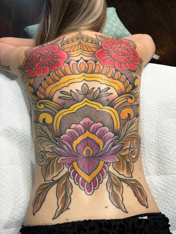 Large colorful floral and ornamental back tattoo by Castro